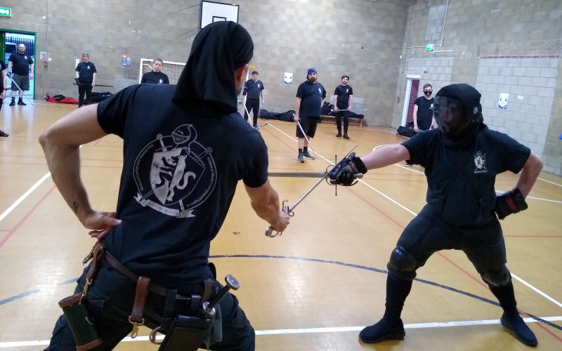 Members of the Academy of Steel participating in a sidesword lesson.